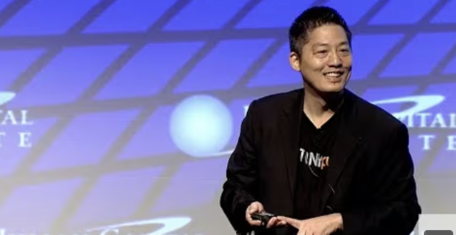 Kevin Nakao speaking on stage at the Human Capital Institute keynote